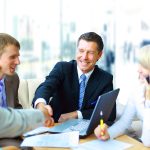 Business people shaking hands, finishing up a meeting